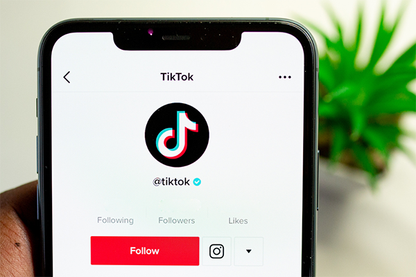 A smartphone is open to the TikTok mobile app.
