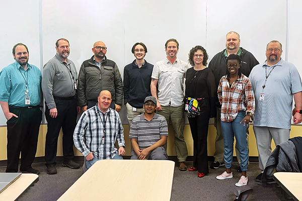 Standing, from left: Brad Avery, Lewis Hofmann, Rebwar Baesmat, Dylan Russel, Gabe Mickel, Kelly Tappenden, Kelly Marosok, Amen Koutowogbe, and Jason Genovesi; kneeling, from left: Cody Rasmussen and Muazzamfaraaz Mohammed.